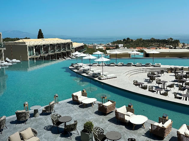 A swimming pool surrounded by sun loungers